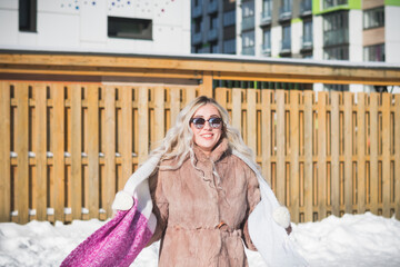 Beautiful russian girl portrait on a snowy street