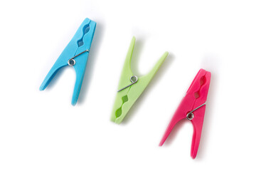 top view of three different color clothespins isolated on white background