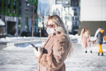 Beautiful russian girl portrait on a snowy street