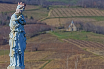 A Virgin-Mary statue looks after the fields over the Beaujolais vineyards