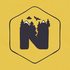 N letter logo with mountains peaks and trees on a landscape line pattern.