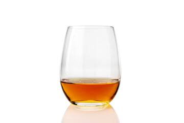 glass of whiskey or whisky or american Kentucky bourbon with its reflection on the plane. isolated on white