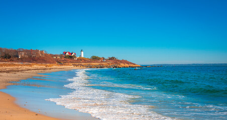 Nobska Lighthouse over the Sea Waves of Vineyard Sound in Woods Hole on Cape Cod