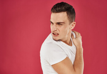 emotional man white t-shirt cropped view discontent red background