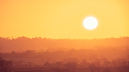 Orange sunrise over the countryside