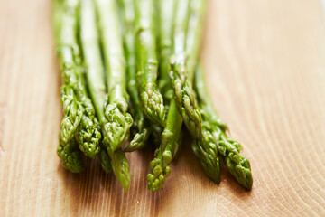 fresh green asparagus on a board