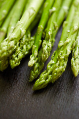 fresh green asparagus on a board