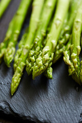 fresh green asparagus on a board