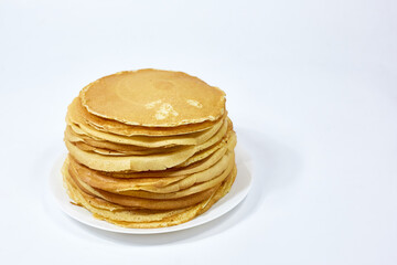 a stack of Russian pancakes on a white background, pancakes on Shrovetide before Lent
