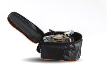 Small orange Gas camping stove in pocket bag.