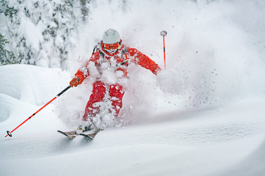 A male skier seen in powder snow in Zauchensee, Austria.
 - Powered by Adobe