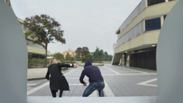 woman takes money from cash machine gets robbed from a thief,female withdrawing bank notes at the bancomat getting mugged from a robber in a cap,atm camera point of view pov