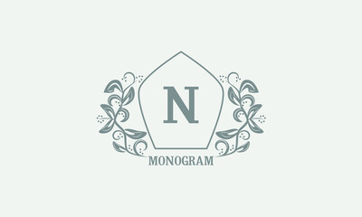 Vintage graceful floral monogram with initials N. Heraldic logo symbol with exclusive calligraphic design elements in gray tones. Business sign, identity for hotel, restaurant, jewelry.