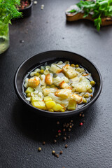 soup vegetable fine pasta first course broth, potatoe, cauliflower, onion, carrot, celery no meat vegetarian or vegan portion on the table meal snack top view copy space for text food background