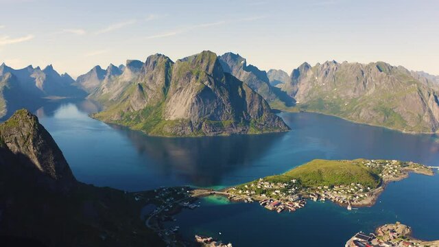 Flying above Reine fishing village with mountains and fjords on Lofoten islands