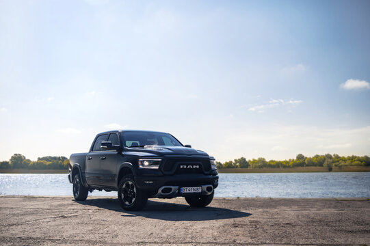 Kherson, Ukraine - May 2019. Powerful american pickup Dodge Ram on the background of the river.