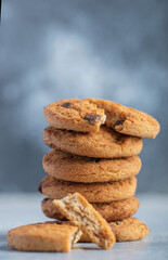 Fototapeta na wymiar Stack of delicious chocolate chip cookies on marble background