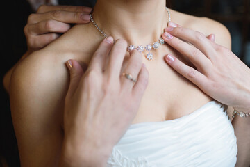 festive necklace on bride's neck