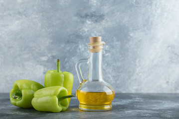 Fresh healthy oil with organic green peppers
