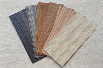 wooden laminated material samples swatch containing multi texture and color of wood placed on light...