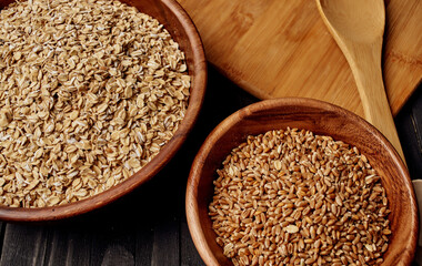 Wheat in a plate of cooking utensils and wooden board