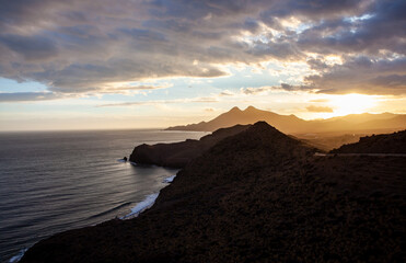 Coastal landscape in golden sunset in Cabo de Gata National Park Almeria Spain