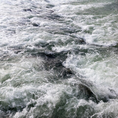 The sparkling turbulent water of the river Vrbas, rapid water movement, power of nature