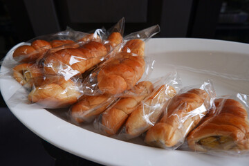 Fresh bread wrapped in hygienic plastic
