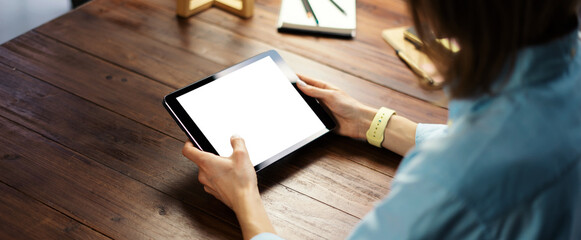 Woman pointing on digital tablet screen, chatting in social networks, meeting website, searching internet, sending sms, using text messenger or online banking. Close up photo