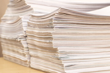 pile of paper documents in the office. waste paper, paper trash