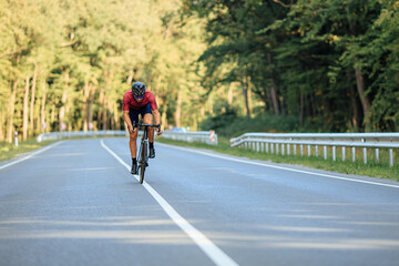 Man riding bike with high speed on asphalt road