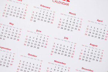 Close up calendar page dates and month background business planning appointment meeting concept