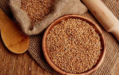 Organic porridge products in a plate of oatmeal kitchen utensils