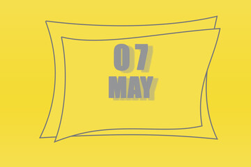 calendar date in a frame on a refreshing yellow background in absolutely gray color. May 7 is the seventh day of the month