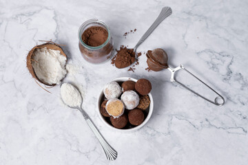 homemade energy balls - truffles made of cocoa and coconut shavings.