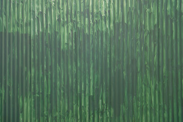 green painted sheet metal wall in the street
