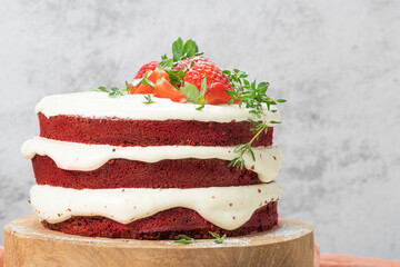 Red velvet cake on wood board. Strawbwrry cake. Devils cake. Wedding dessert. Birthday party. Delicious dessert. Traditional american dessert.