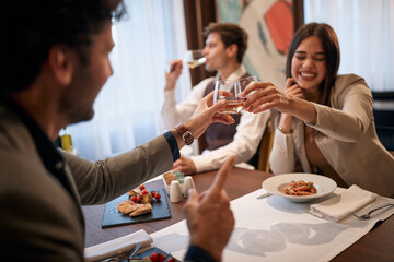 Young business people having good time at business lunch at the restaurant. Business, restaurant, lunch