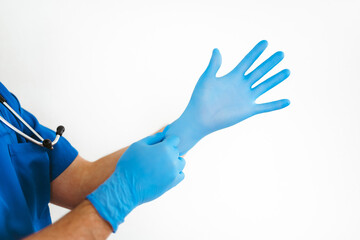 Hands of a doctor putting on gloves