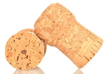 Two light brown wine corks, close-up, on a white background.