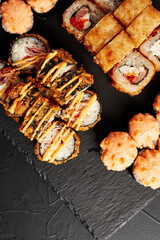 set of rolls on a black textured background    top view