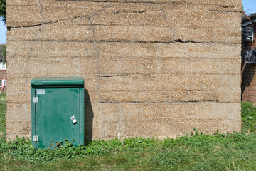Old concrete building with utilities cabinet in Dovercourt Essex. Weathered old concrete building,...