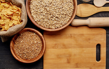 Wheat in a plate of cooking utensils and wooden board