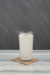 Healthy drink in tall glass, homemade probiotic. Water kefir or fermented drink made with water and symbiotic culture of bacteria and yeasts