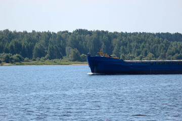 cargo ship on the river Volga in summer time