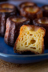 Extreme close up of a Canelés de Bordeaux cut in half