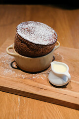Chocolate souffle served on wooden plate