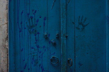 handprint on blue wall 