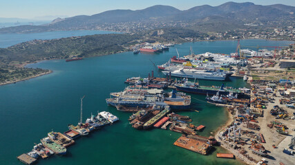 Fototapeta na wymiar Aerial drone photo of industrial shipyard in old port of Salamina island, Attica, Greece