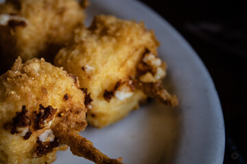 Fried cheese on a skewer.